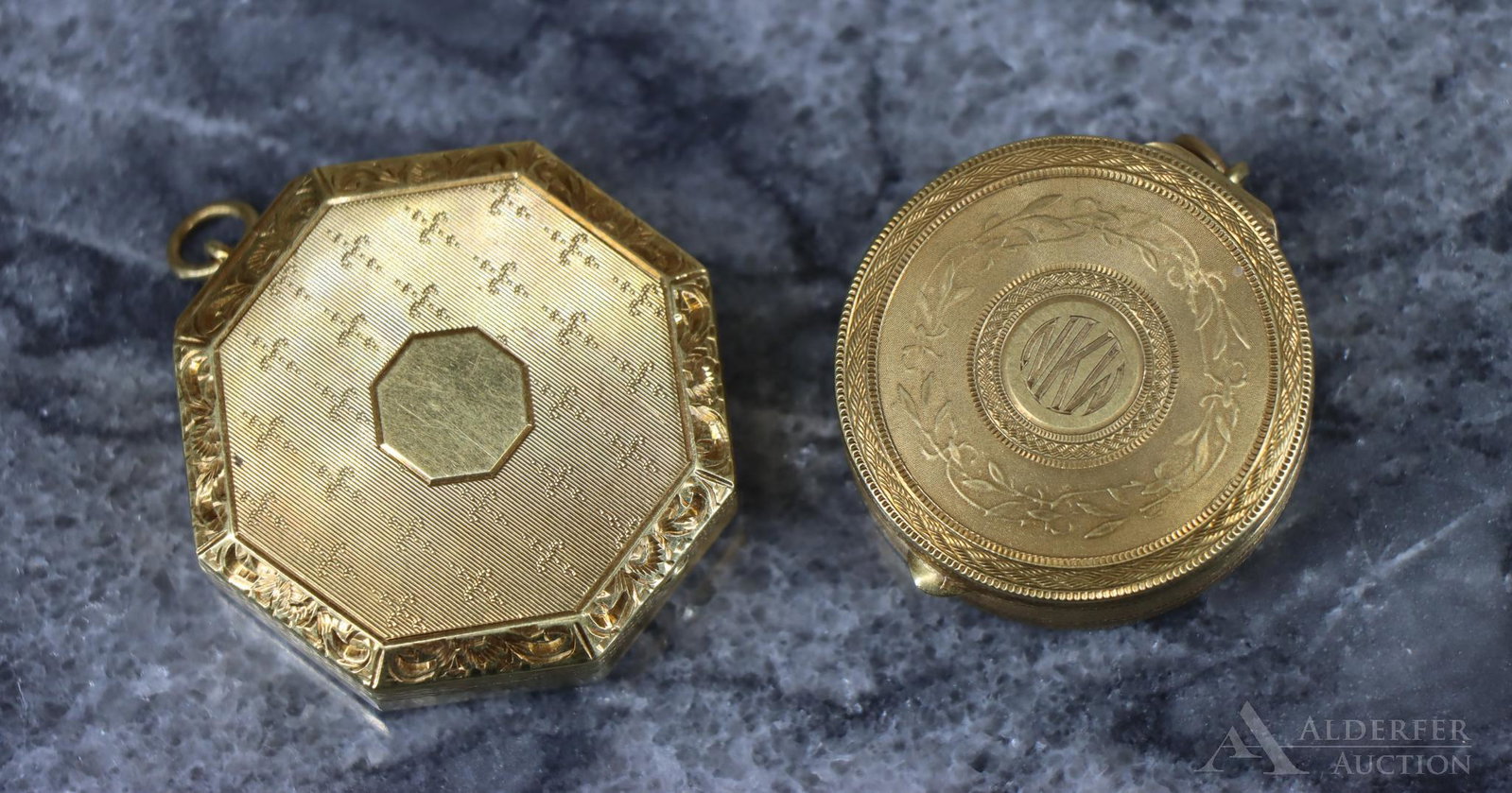14k Gold Compacts: Pair of 14k yellow gold compacts, the circular decorated with guilloche florals and geometrics and the octagonal with hand tooled borders. Circular compact is monogrammed. Largest 1.625". 26.2dwt
