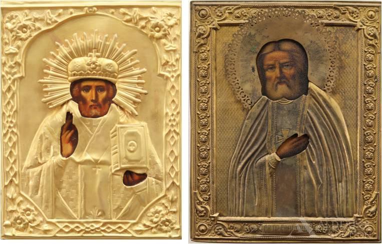 Russian Icons, Saints Seraphim of Sarov & Nicholas, the: Gilt repousse rizas / oklads with applied halos, over temperas on panel, of St. Seraphim and St. Nicholas. 19th - early 20th century. St. Seraphim 9"h x 7"w. St. Nicholas 9"h x 7"w **Please 