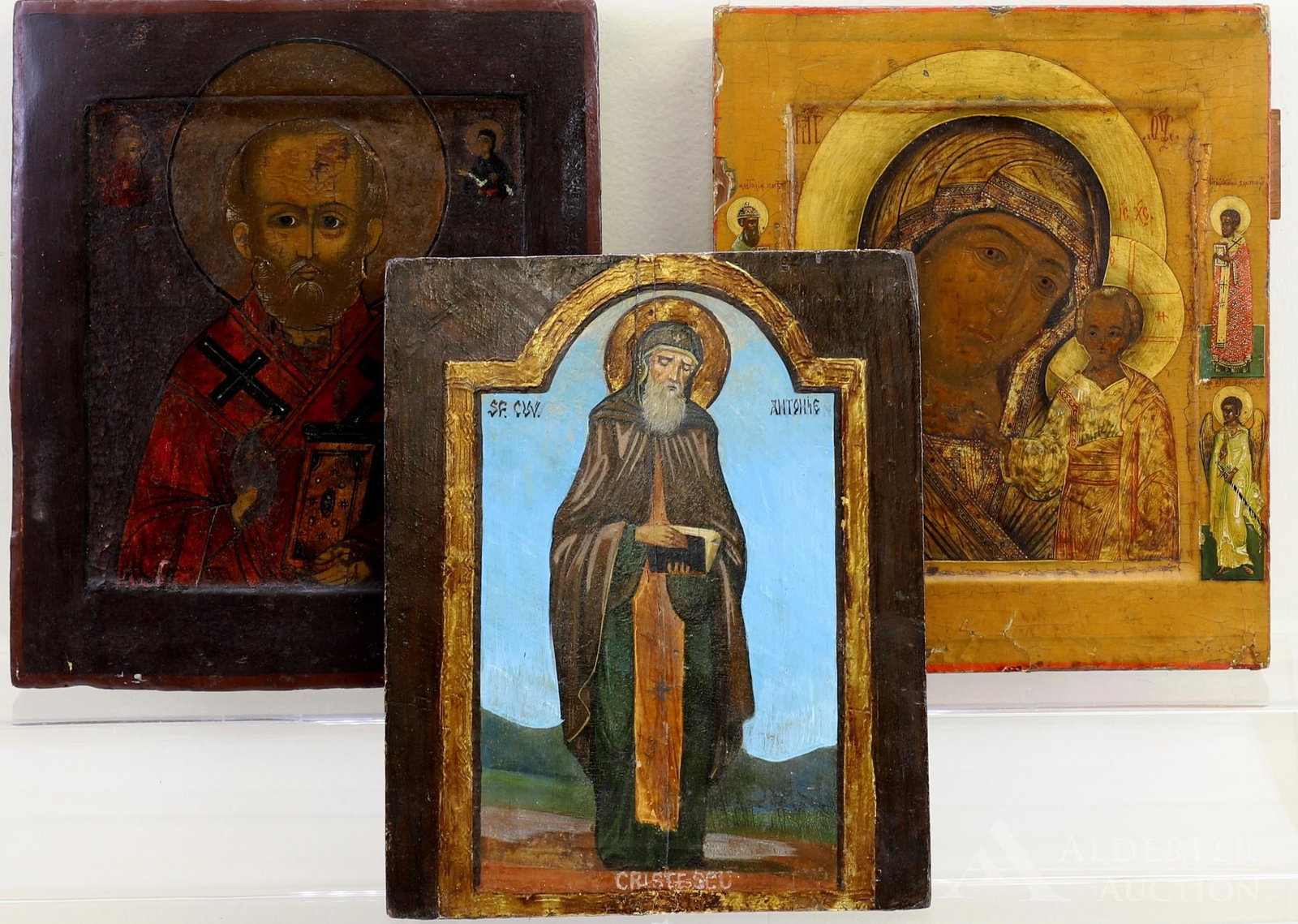 Russian Icons, Theotokos, St. Nicholas, & St. Anthony: Tempera on gesso on panel. St. Nicholas the Wonderworker, stamp en verso. 12.5"h x 11"w. St. Anthony with gilt accents, inscription en verso. 11.75"h x 9.5"w. Theotokos Mother and Child with