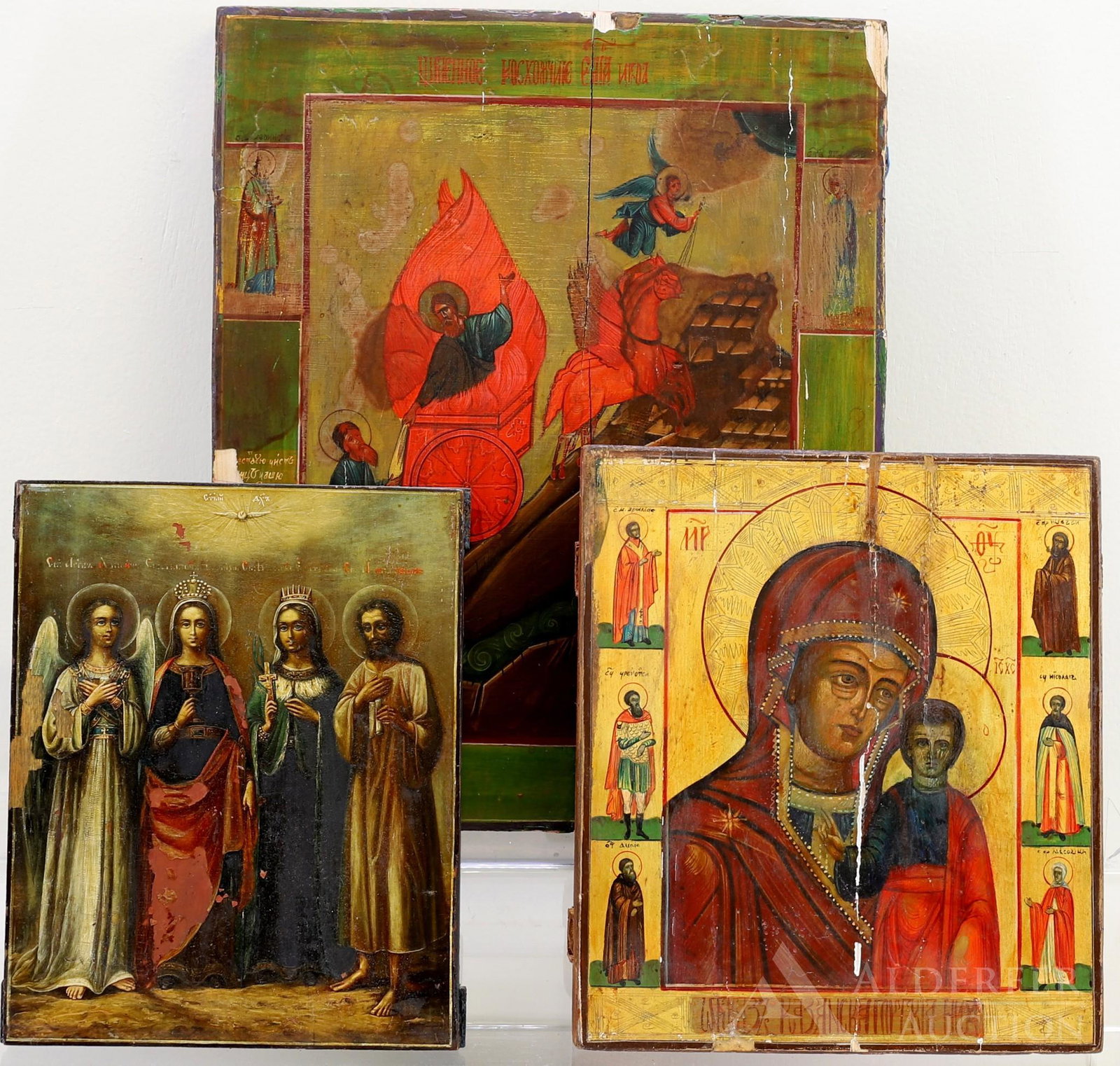 Russian Icons, Prophet Elijah, Theotokos, & Selected: Tempera on gesso on panel, ascension of Prophet Elijah in the chariot of fire, the borders with selected saints and gilt script. 16"h x 13"w. Tempera and heavy gilding on gesso on panel, Theotoko