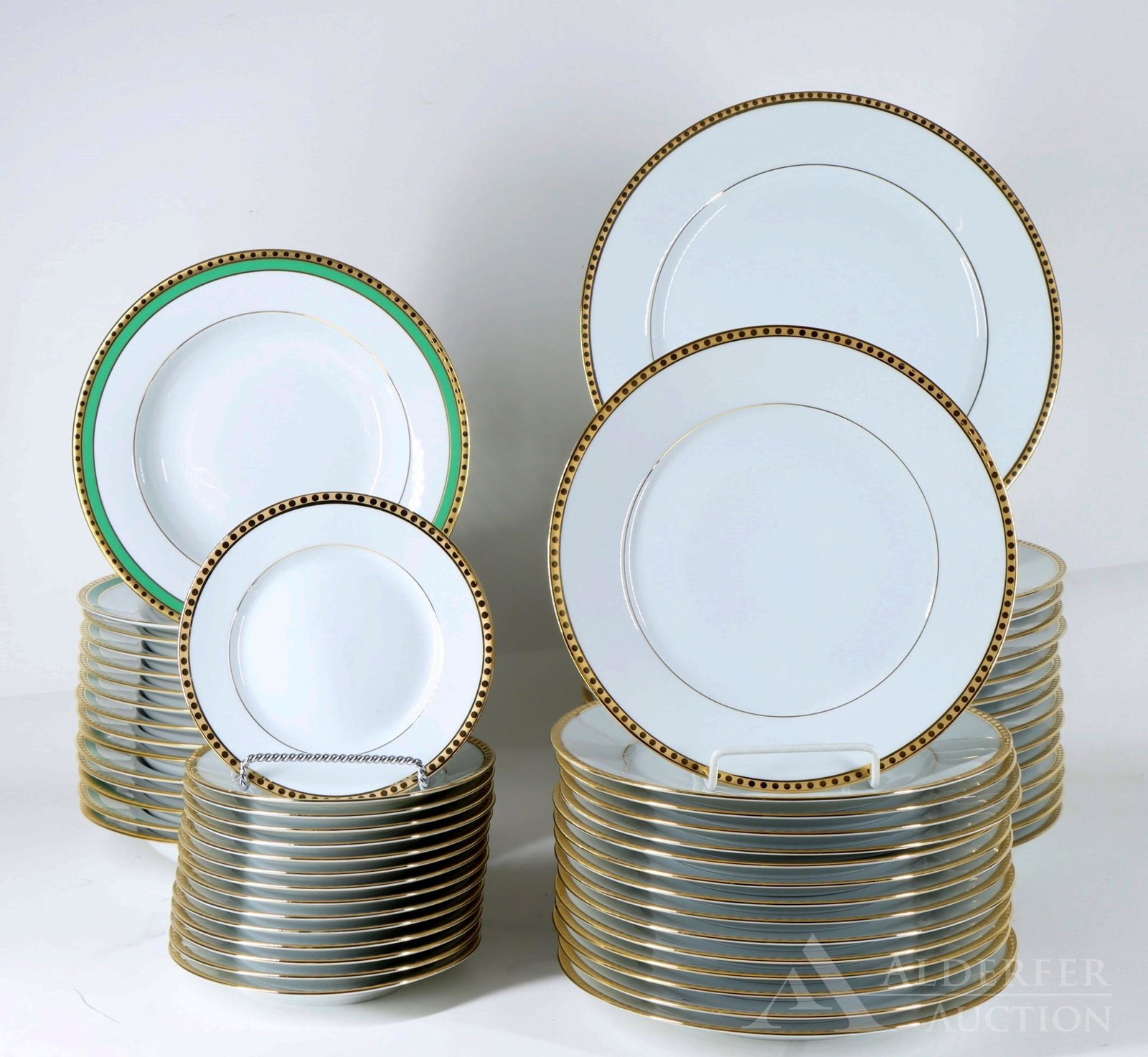 Limoges for Tiffany China, Gold & Green Band: Service for (15), including dinner plates, salad plates, and bread & butter plates in the Gold Band pattern, with soup bowls in the Green Band pattern. Dinner plates 10.75"w **Please Note: This i