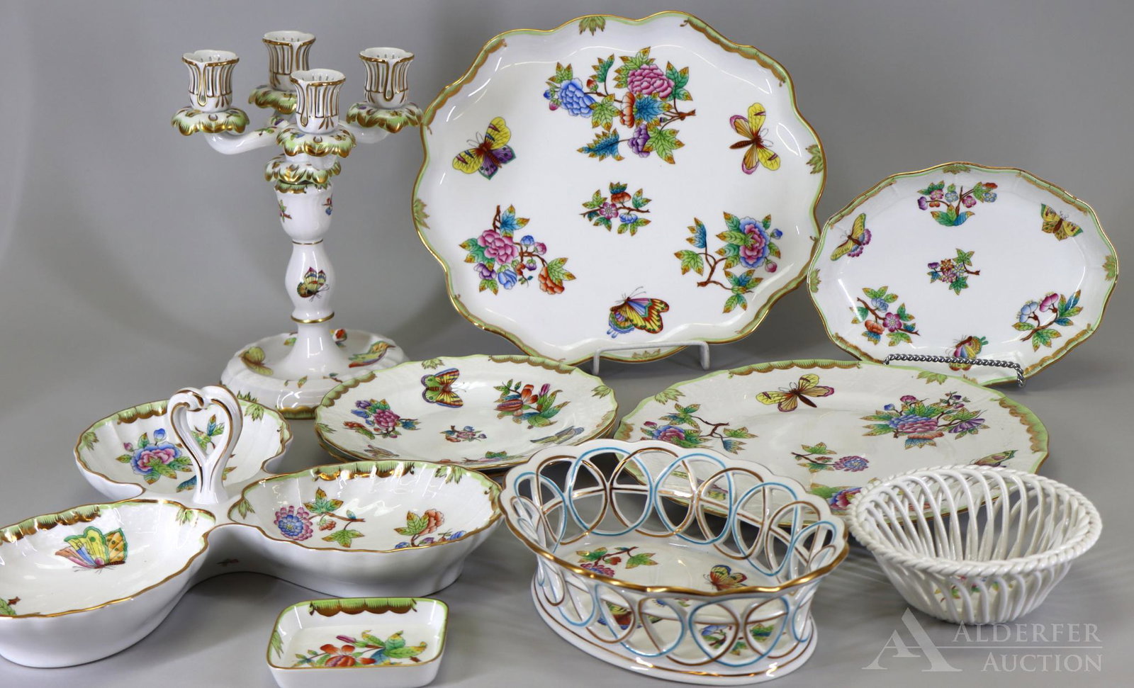 Herend "Queen Victoria" Porcelain Tablewares: Green border variation, includes dinner plate, salad plates (2), scalloped oval platter, oval relish, 3-part shell form relish, oval basket, small round basket, rectangular ashtray, and 4-light candel