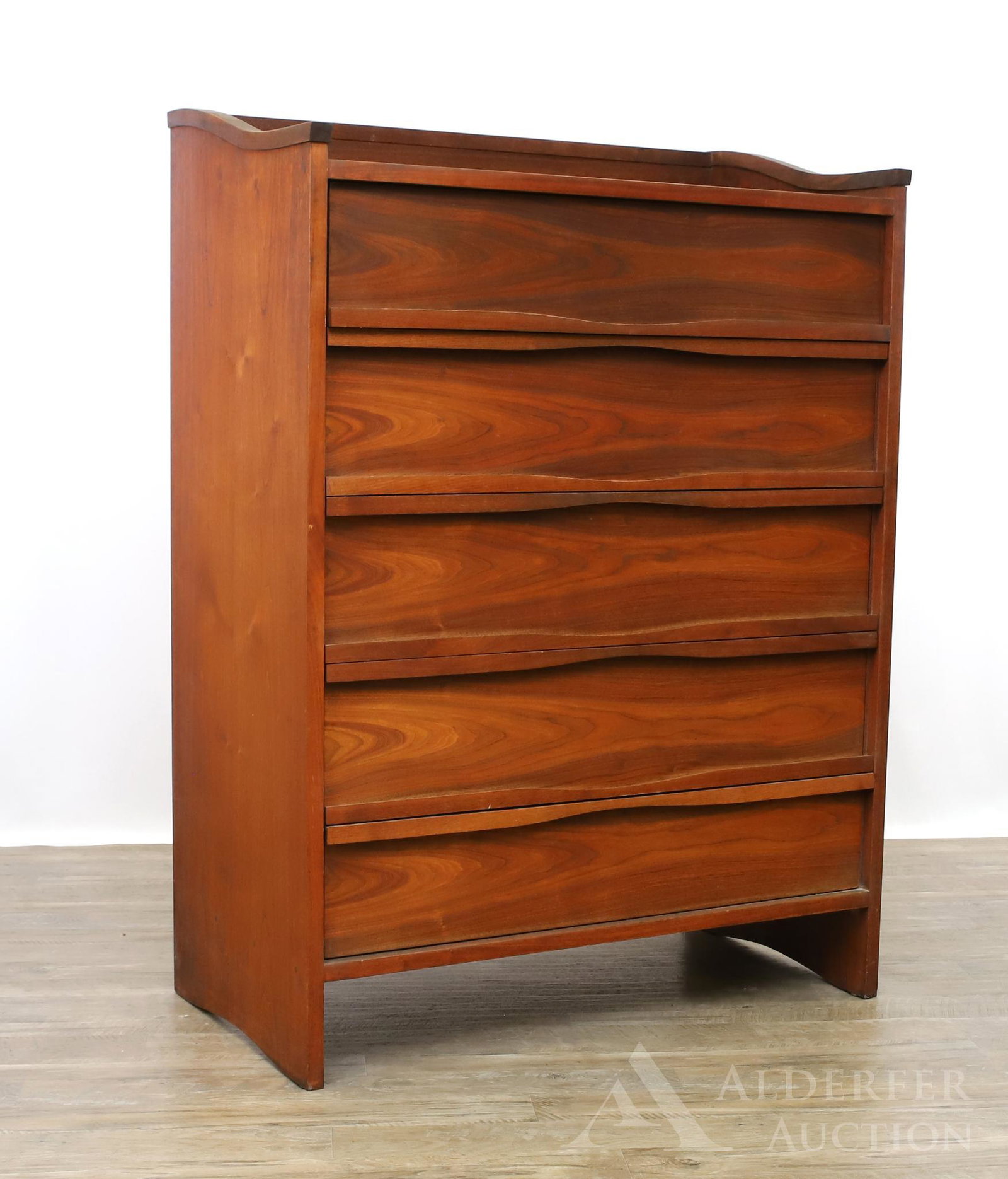 George Nakashima for Widdicomb Chest of Drawers: Walnut case, top having a backsplash and sloped edged sides, six drawers, curved straight feet. 54"h x 39"w x 21"d **Please Note: This item is NOT eligible for in-house shipping. Please refer to
