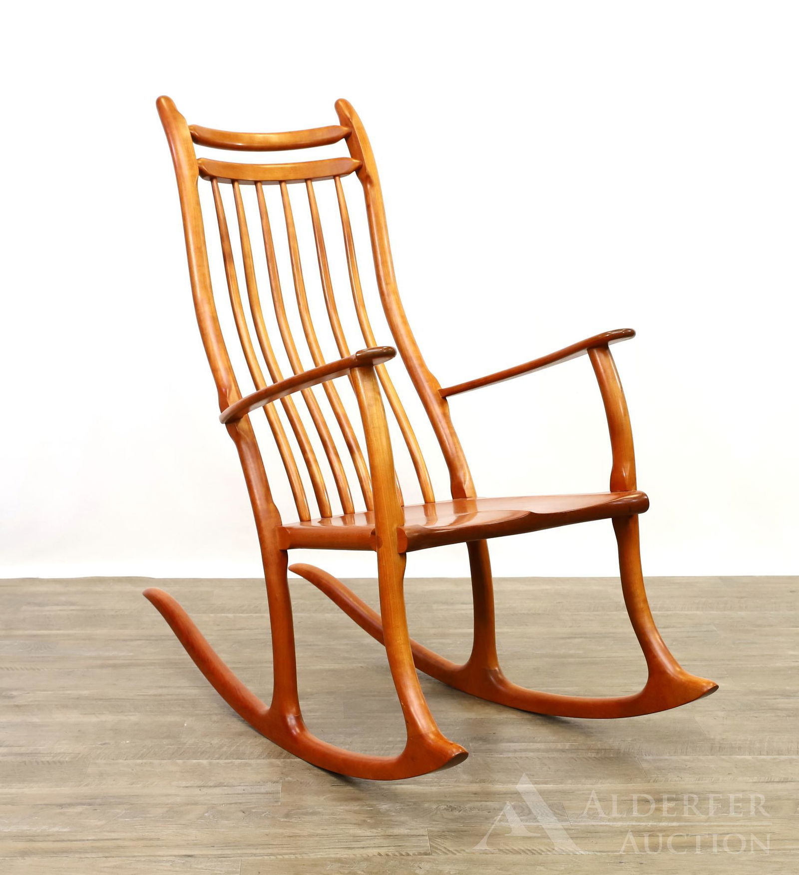 Signed Stephen Swift "Nantucket" Cherrywood Rocker: Handcrafted with tenon and half-lap dovetail construction. Curved back spindles and legs, sculpted saddle seat. Signed and dated, "Stephen Swift 2005" on underside. 44"h x 23"w x 19"d **Please Note: T
