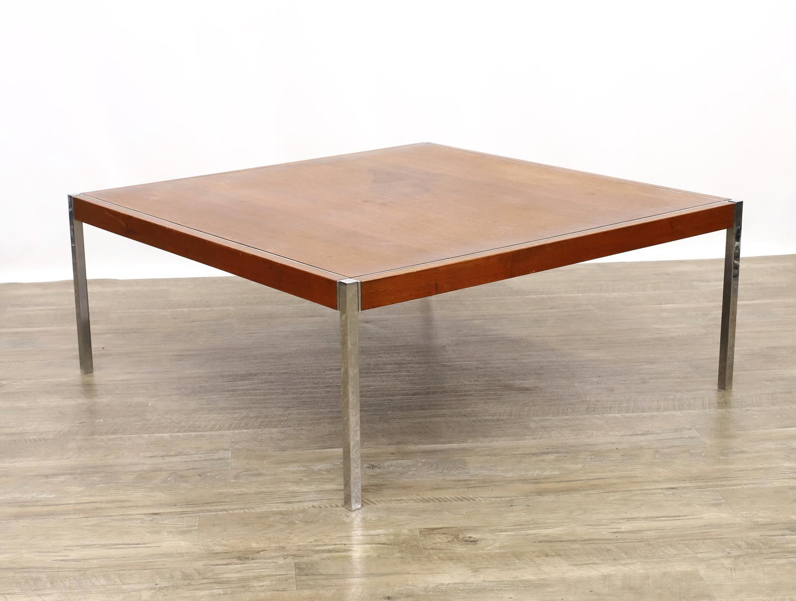 Knoll Coffee Table: Walnut with chrome steel frame and legs. Watermarks are present on top surface. 16"h x 40"w **Please Note: This item is NOT eligible for in-house shipping. Please refer to the terms and conditions of 