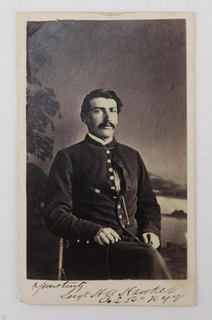 CDV of Sergeant Henry A. Hawkes-56th New York Infantry: Carte de visite photograph of a knees up seated view of Henry A. Hawkes wearing uniform with sergeant's stripes. Carte presents autographed inscription at lower obverse "Yours truly, Sergt H.A. Hawkes