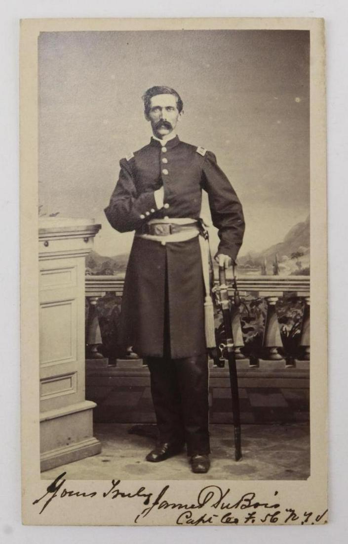 CDV of Captain James DuBois-56th New York Infantry: Carte de visite photograph of a full standing view of James DuBois wearing uniform with captain's shoulder straps and holding sword. Carte presents autographed inscription at lower obverse "Yours trul