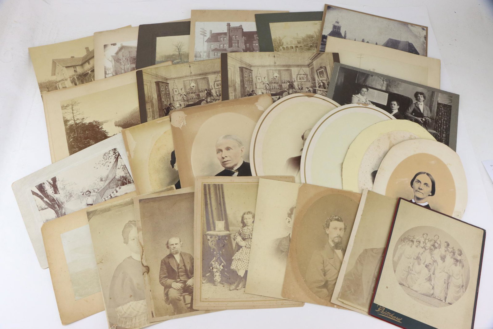 Nineteenth Century Photography: Late 19th century photography mounted to boards ranging in size from 4" x 3" to 8" x 11". Grouping includes (15) portraits including theatrical group of women and one group of musicians. Group further