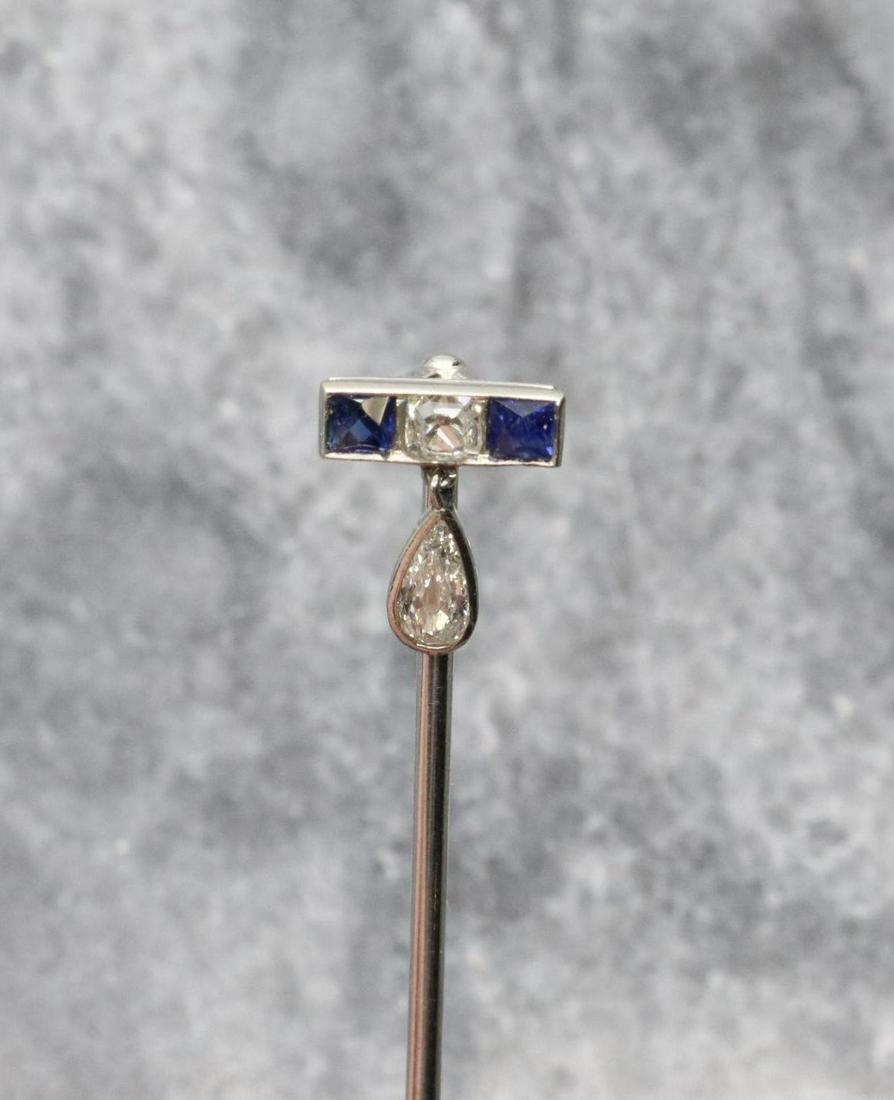 Cartier Platinum Sapphire and Diamond Stickpin: Square cut sapphires flank a center diamond in a bar above a sparkling diamond teardrop dangle. Approx. .44+-ctw diamonds. 2.2gtw