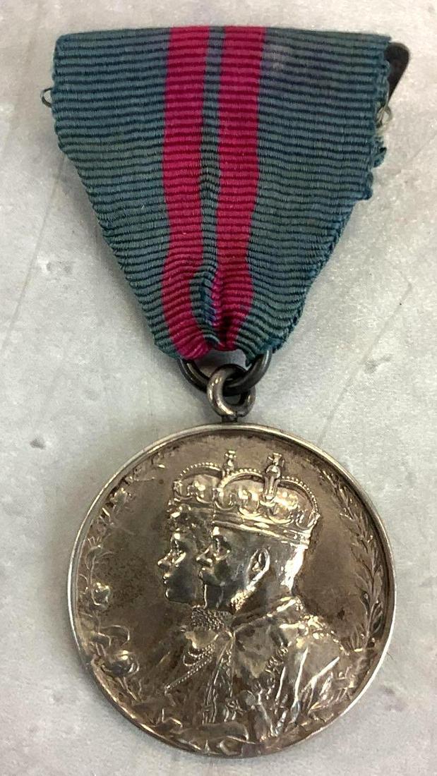British George V Coronation Medal-Argyll and Sutherland: British George V Coronation medal impressed named "WM. MITCHELL ST. SGT A&S HRS". Medal exhibits toning and wear/fading to ribbon. Provenance: Stanley Bright collection.