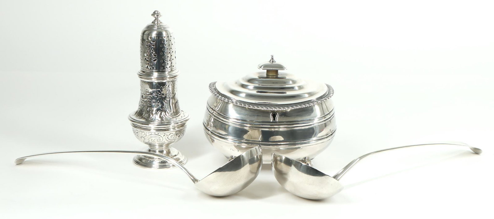 George III & IV Sterling Silver Tablewares: Richard Crossley, London 1787, punch ladle with engraved pointer dog at the terminal, 13". Solomon Hougham, London 1804, punch ladle with engraved hand-and-quill at the terminal, 12.5". Susannah Barke