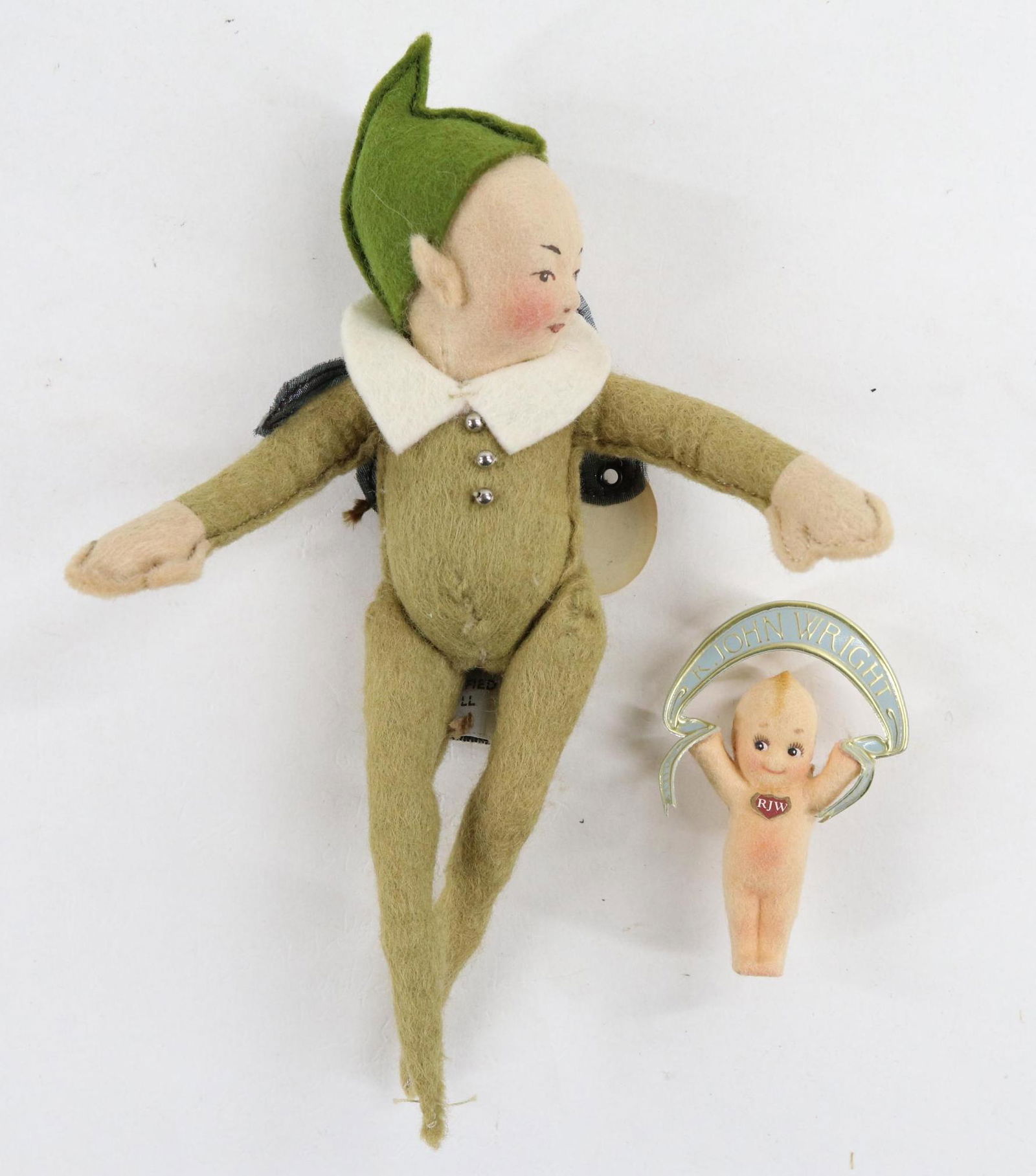 LOT OF R. JOHN WRIGHT.: Lot. 7" "Pixie" with early R.J.W. tag and NIADA tag. No box. Kewpie pin holding R. John Wright banner. Overall height 2 1/2" . No box.