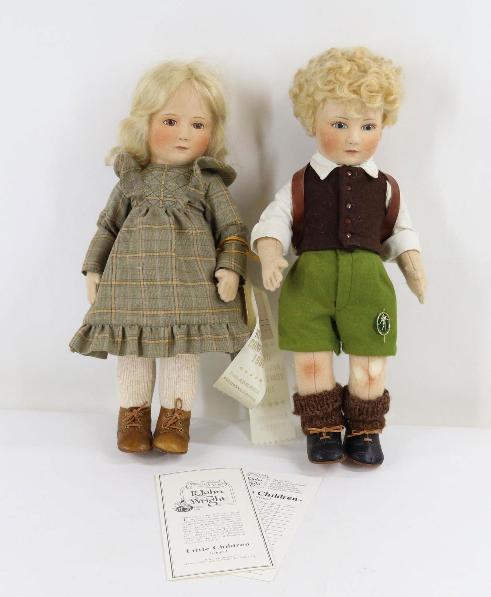 LOT OF R. JOHN WRIGHT.: Pair of tagged "Little Children" Series I dolls. 16 1/2" "Hannah" 6/250. 17" "Peter" 151/250. NIADA tag. Condition: loss on front of left leg, back of right leg, back of pants. No boxes. This lot is b
