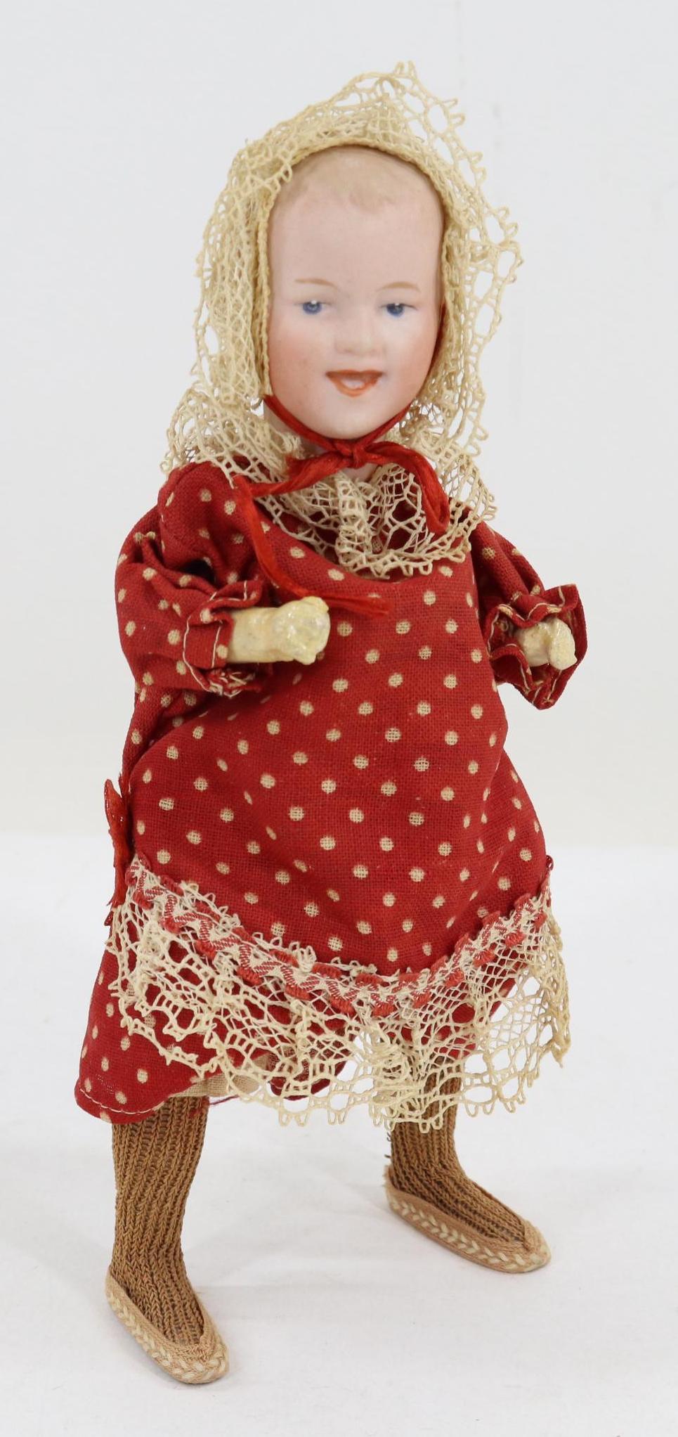 LOT OF HOLIDAY/NOVELTIES.: 7 1/2" Wind up mechanical 7/0 6 (Heubach square) 14 GERMANY Doll that when wound goes from side to side. She has a solid dome bisque head, blue intaglio eyes, open/closed mouth with two-teeth on botto
