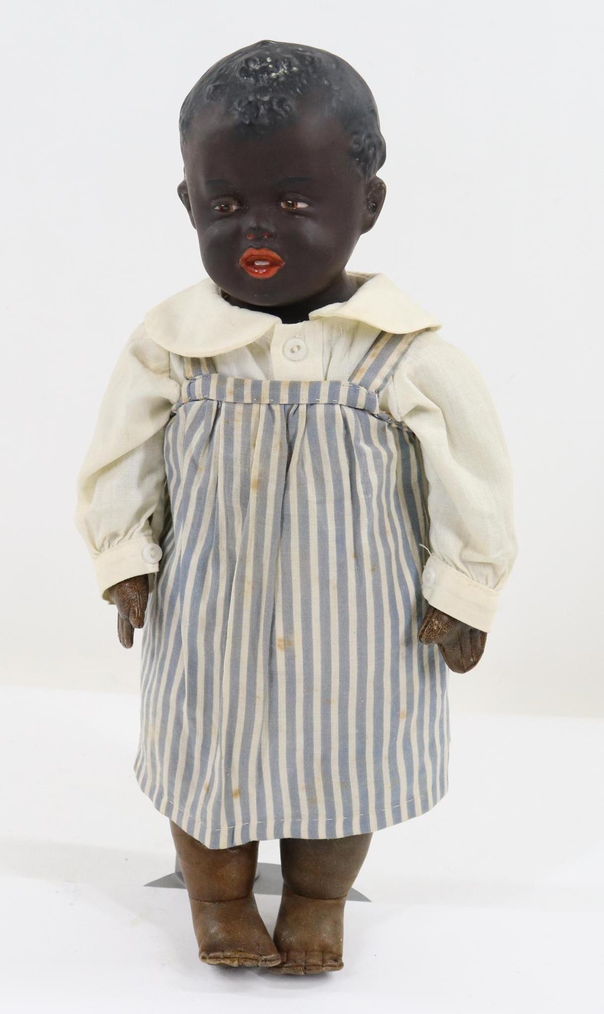 GERMAN BISQUE HEAD CHARACTER DOLL.: 14" Black 5 (HEUBACH Sunburst) (mold 7659) GERMANY shoulder head doll with a solid dome, molded hair. Brown intaglio eyes, open/closed mouth with (2) teeth showing. Painted black hair. 5 Pc. brown lea