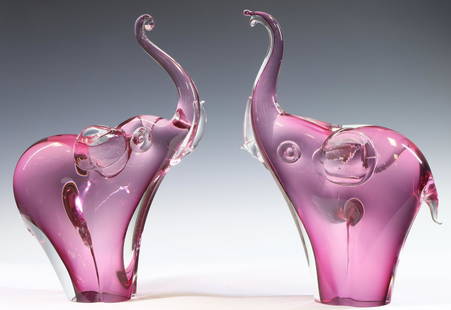 Murano Art Glass Elephants: Italian blown glass male and female pink elephant sculptures. Damage to an elephant. 13.5"h x 3"w x 10"d **Please Note: This item is NOT eligible for in-house shipping. Please refer to the terms and