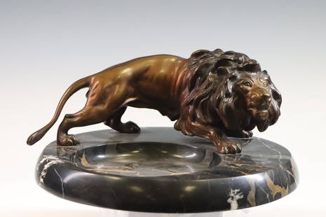 Art Deco Desk Tray with Lion: Bronze patinated lion sculpture mounted to a marble tray. Repair to tail. 5"h x 11.5"w **Please Note: This item is NOT eligible for in-house shipping. Please refer to the terms and conditions of this