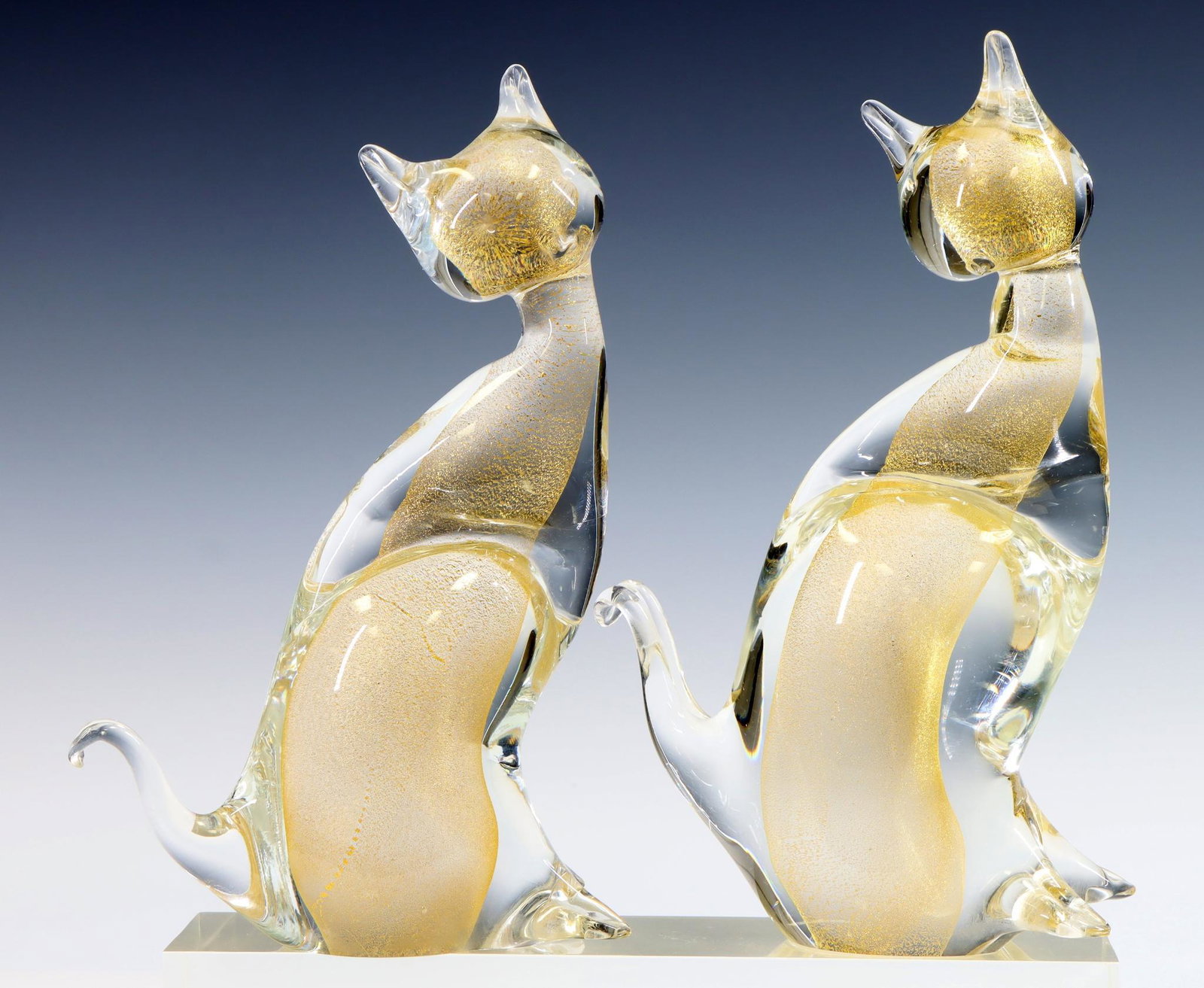 Murano Art Glass Cats: Pair of Italian blown glass sommerso and aventurine cats. 8.5"h x 5.5"w x 2"d **Please Note: This item is NOT eligible for in-house shipping. Please refer to the terms and conditions of this auction f