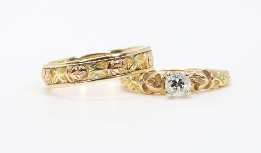 14K Tri-Colour Gold Diamond Rings. Bridal Set: Bridal set in 14k tri-colour gold features a rosebud motif and a diamond solitaire. Engagement ring is set with a round diamond, 4.4mm. Matching eternity band is 4.3mm wide, size 6.5. Set, 6.4gtw