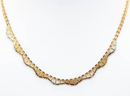 14K Tri-Colour Gold Necklace: Necklace in 14k tri-colour gold features a scalloped edge lined with bead detailing, 16" long with a pressure tongue clasp, and safety catch.15gtw