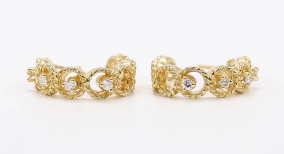 14KY Gold Diamond Hoop Earrings: Hoop earrings in 14ky gold feature rope circles accented by round diamonds, (4) in each earring, pair approx. .24ctw. Three quarter hoops are .75" round with posts and clutches. 5.4gtw