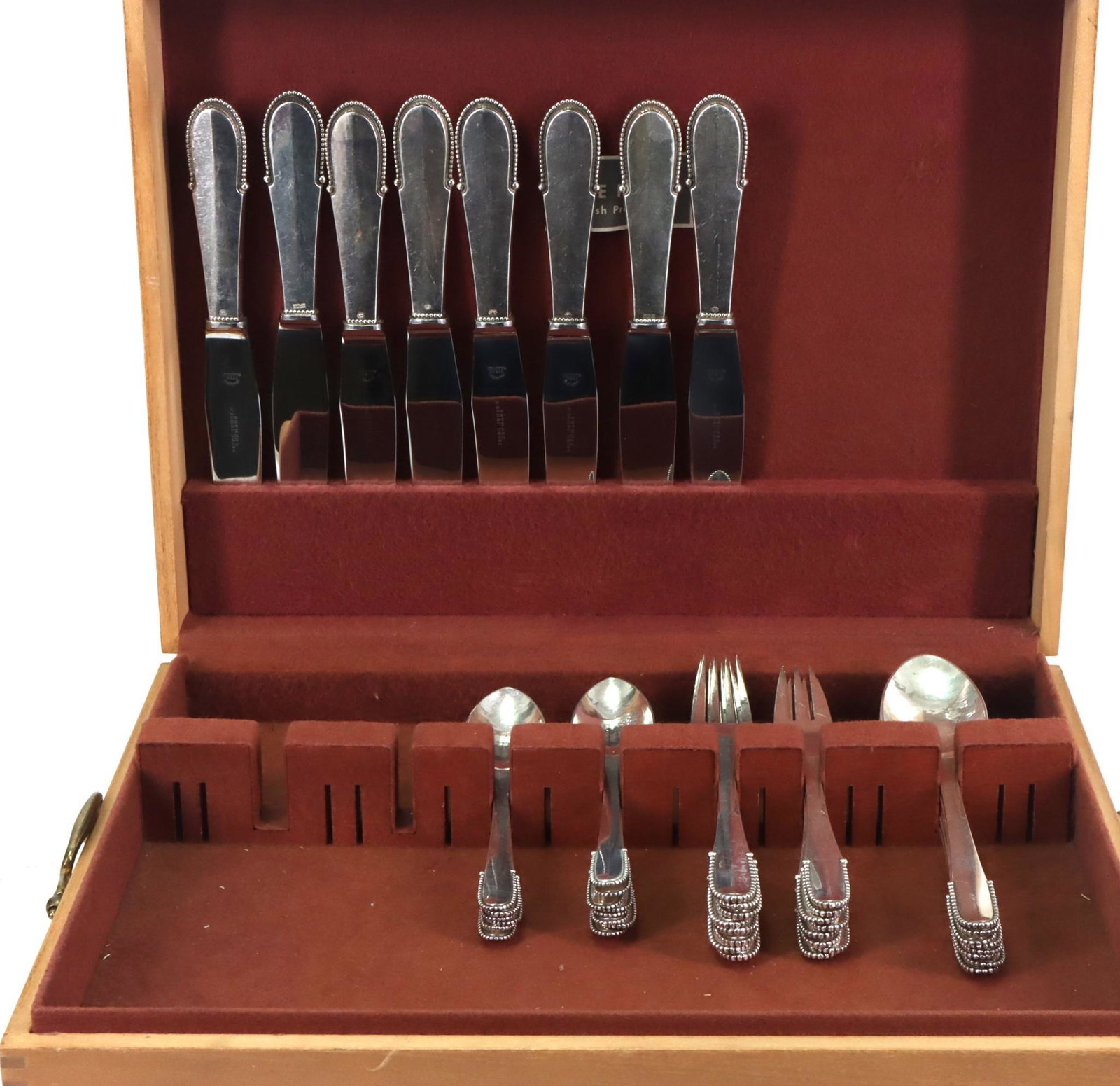 Georg Jensen "Beaded" Sterling Silver Flatware Service for 8 with Extras: Danish flatware with hammered finish, including dinner forks (7"), salad forks, hollow handle knives, place spoons, and teaspoons. Knives 9". Also includes a storage case, 5.75"h x 15"w x 11"d. (46) p