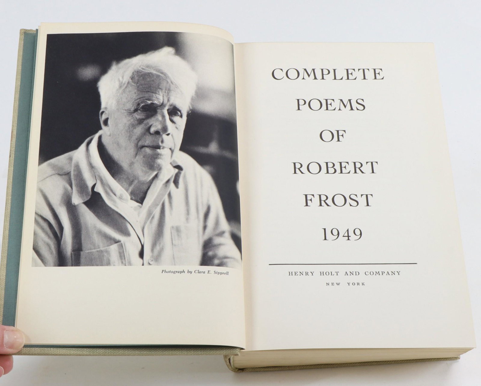 "Complete Poems of Robert Frost 1949", Signed First Printing: "Complete Poems of Robert Frost 1949", Henry Holt and Company, New York, first printing, signed, numbered 446 of 500; the flyleaf with author's presentation inscription of "The Secret Sits" couplet, s