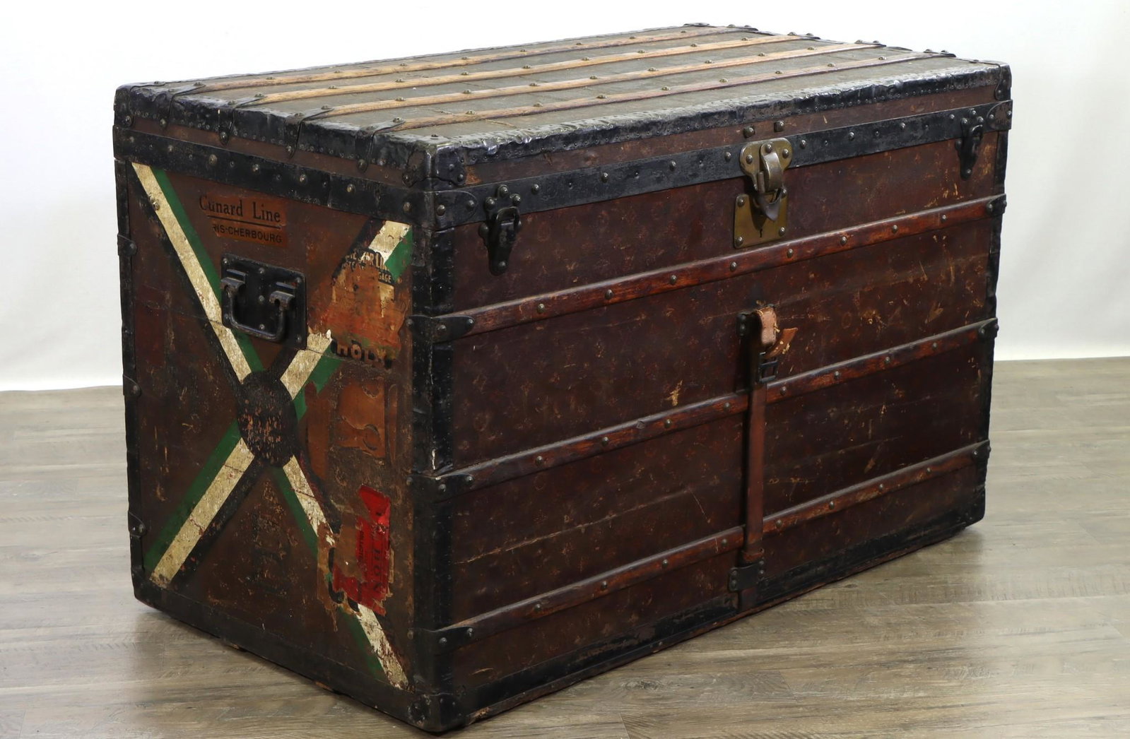 Louis Vuitton Flat Top Steamer Trunk: Leather, wood and monogrammed stenciled canvas trunk, leather handles both intact with remnants of center strap. Includes original interior tray and insert. Loss to monogram on reverse. Original hardw