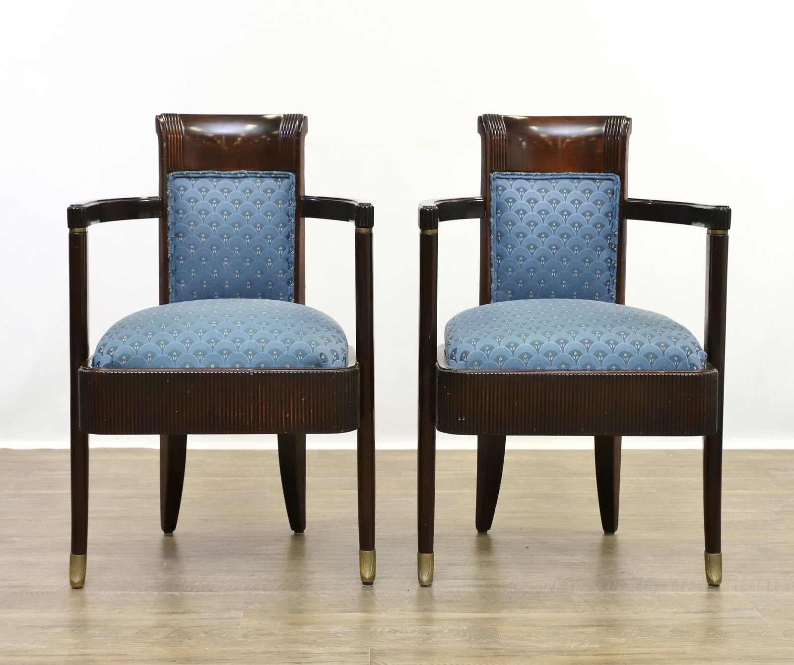 Pierre Patout S.S. Normandie Luxury Liner Armchairs: First Class Art Deco dining chairs from the French Luxury Liner S.S. Normandie having reeded crests and skirts with semi-circular arms and swept feet with brass caps. Textured upholstery. Early 20th c