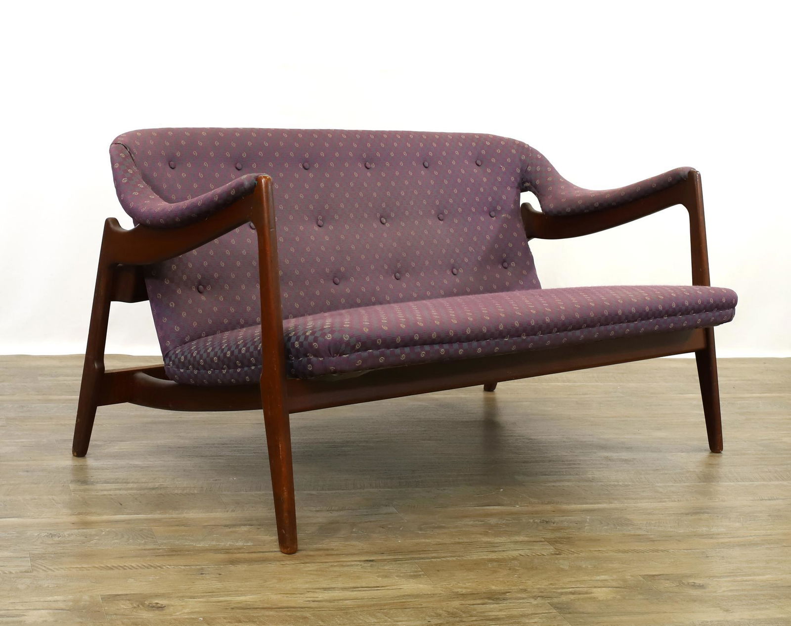Danish Settee Attributed to Finn Juhl and Niels Vodder: Mid-century modern settee. Walnut with an angular form, continuous crest into open arms, tapered legs, with button back textured fabric upholstery. 26"h x 53"w x 28"d, 15" seat height **Please Note: T