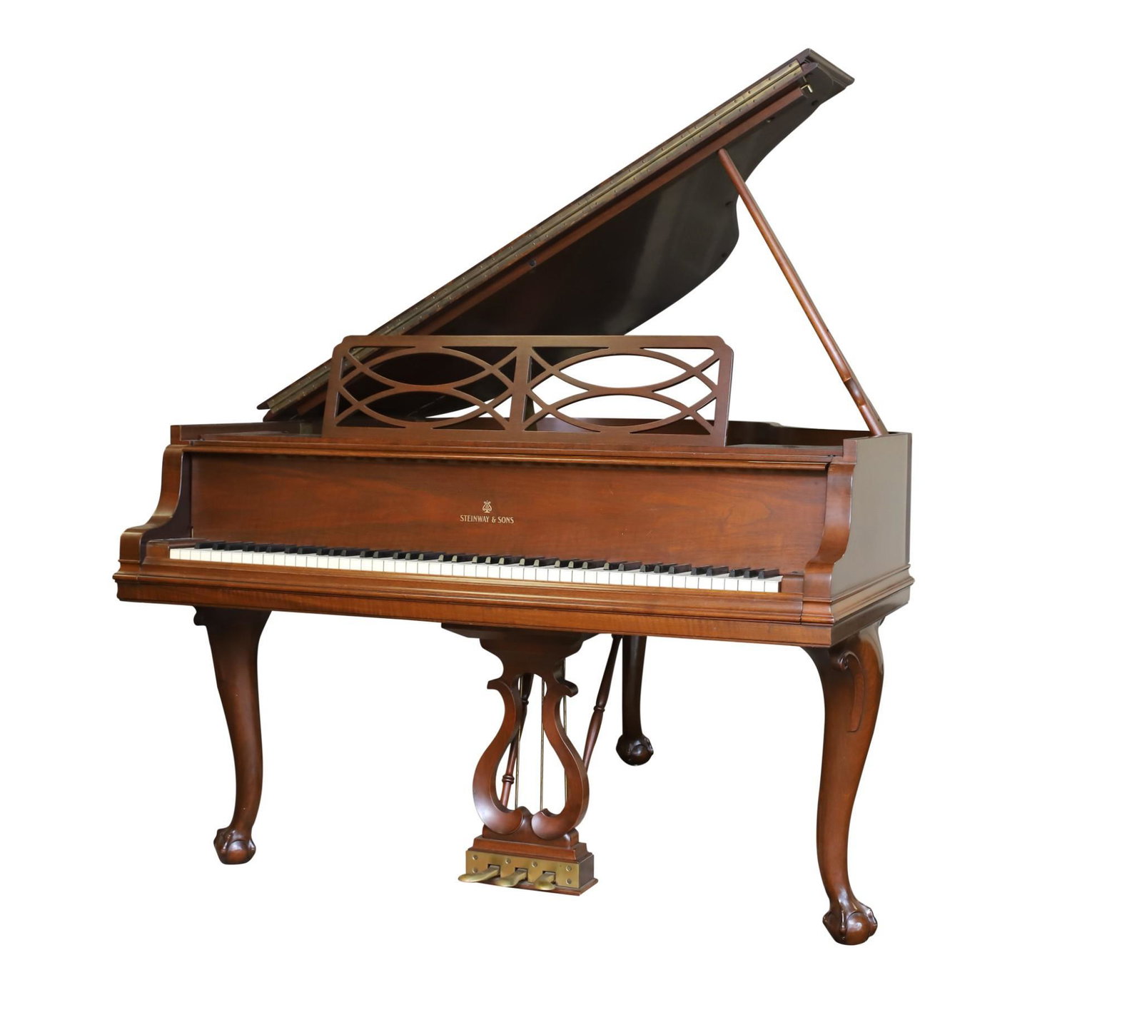 Steinway Studio Grand Piano: Model M. Serial No. 350842. Chippendale style with a walnut case, lyre pedal stand on cabriole legs and claw and ball feet. 67"h (open) x 56"w x 60"d. Lot also includes a mahogany trifid foot stool. 1