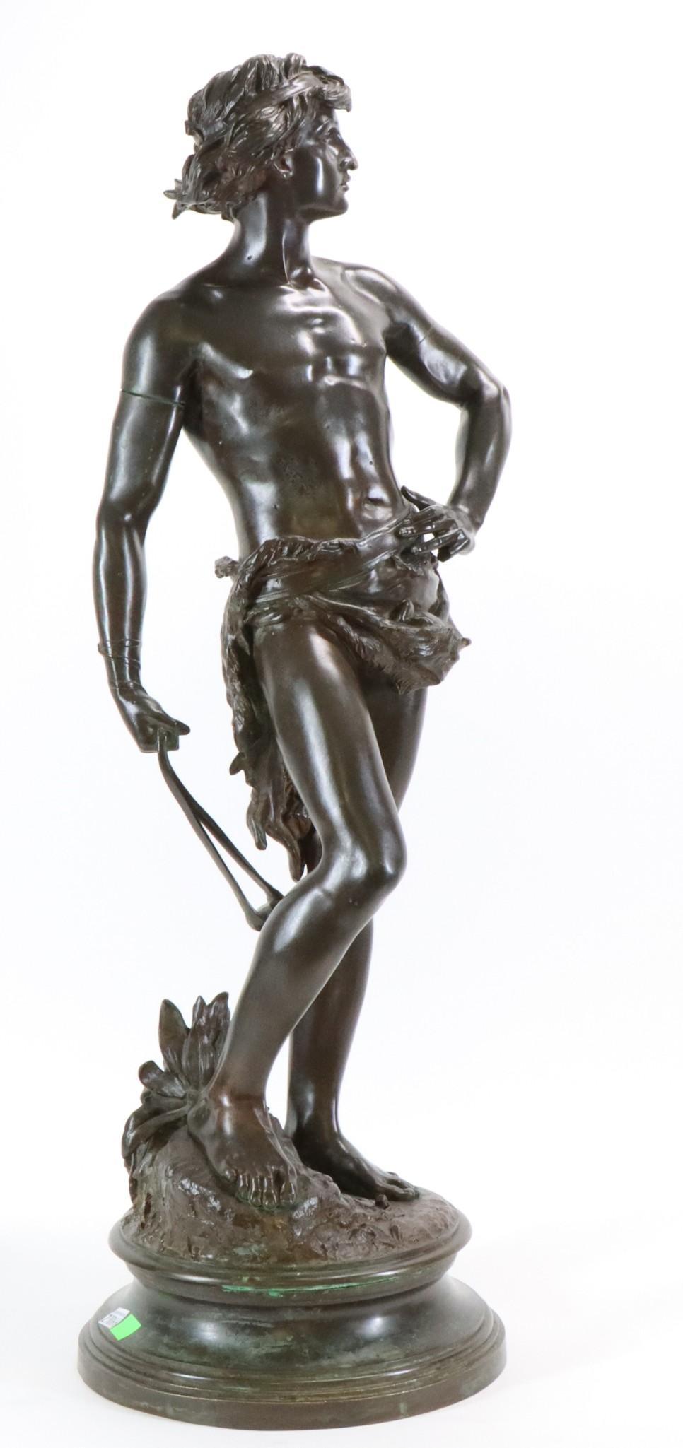 Adrien Etienne Gaudez (1845 - 1902): Bronze patinated sculpture of David with his slingshot. Signed to base. 33"h x 10"round overall. **Please Note: This item is NOT eligible for in-house shipping. Please refer to the terms and condition