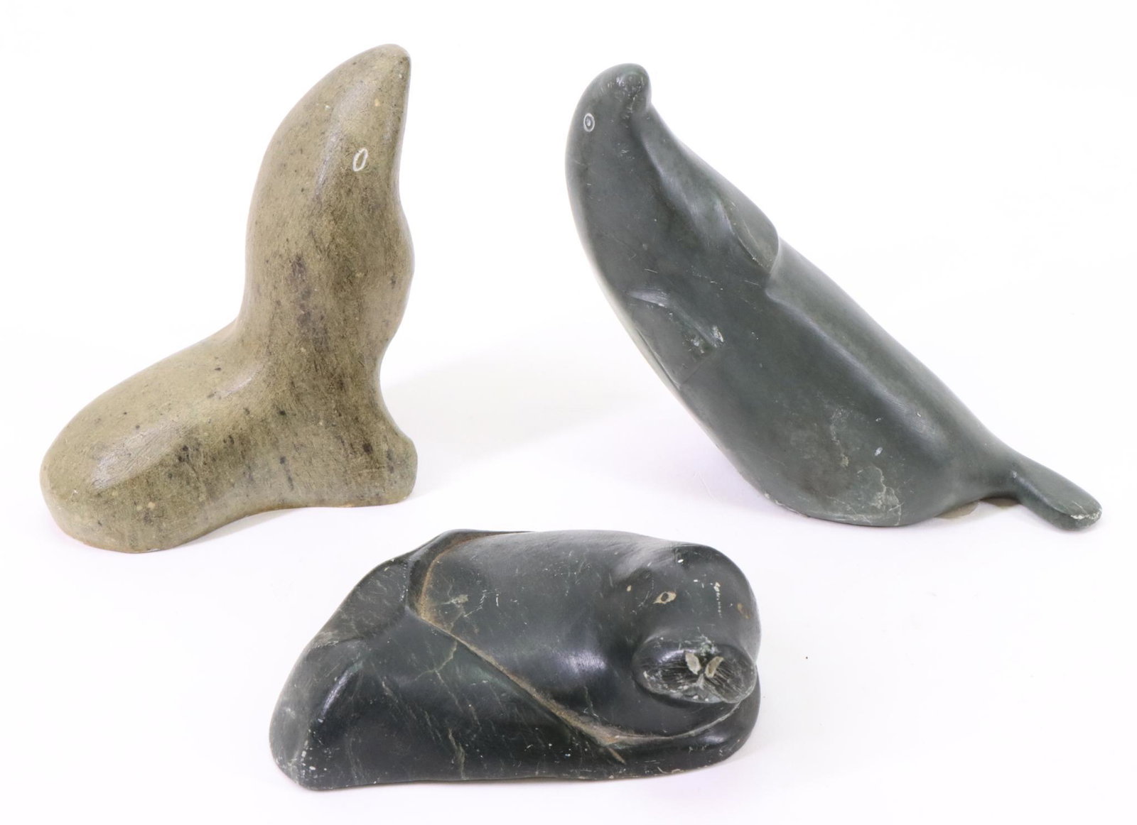 Inuit Carvings of Seals: Inuit carvings of seals (3), all signed. Largest measures 4”h x 5”w