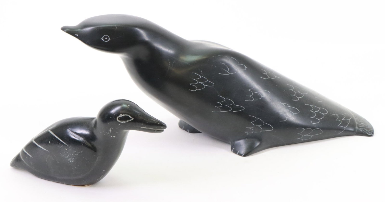 Inuit Carvings: Inuit carvings (2) of sea birds, one signed. Largest measures 4.5”h x 11”w