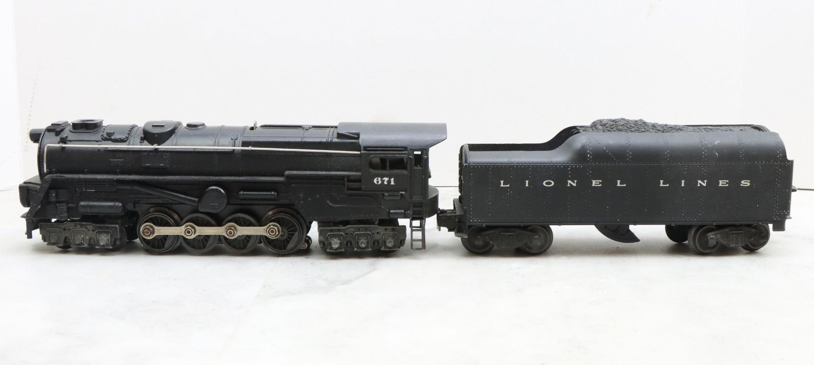 Lionel Trains 671 Locomotive and 2046W Tender: Postwar, O gauge, 6-8-6 locomotive 671, and tender 2046W.