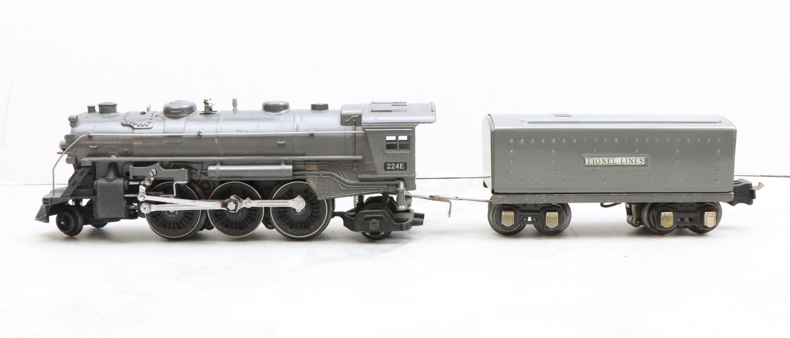 Lionel Trains 224E Locomotive and 2689W Tender: Prewar, O gauge, 2-6-2 gunmetal gray locomotive 224E, and gunmetal gray tender 2689W.