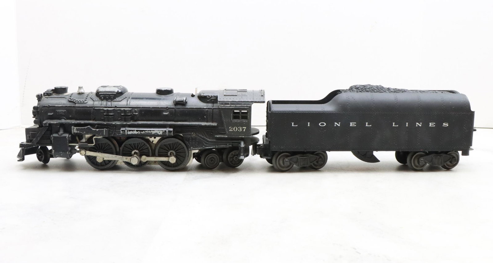 Lionel Trains 2037 Locomotive and 2046W Tender: Postwar, O27 gauge, 2-6-4 locomotive 2037, and tender 2046W.
