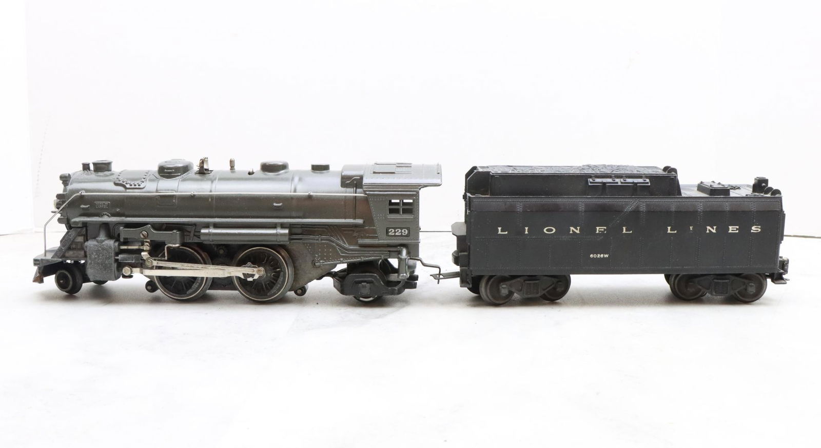 Lionel Trains 229 Locomotive and Tender: Prewar, O gauge, 2-4-2 locomotive 229, and unmarked tender.