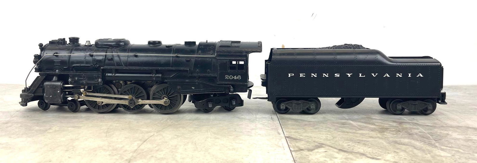 Lionel Trains 2046 Locomotive and 2046W-50 Tender: Postwar, O27 gauge, 4-6-4 locomotive 2046, and tender 2046W-50.