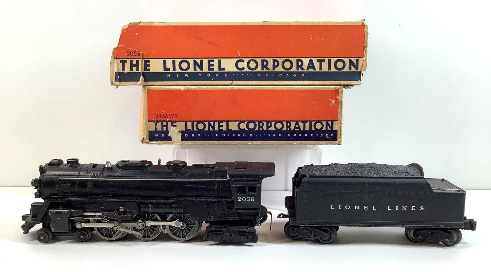 Lionel Trains 2055 Locomotive and 2466WX Tender: Postwar, O gauge, 4-6-4 locomotive 2055, and tender 2466WX, both with original boxes.