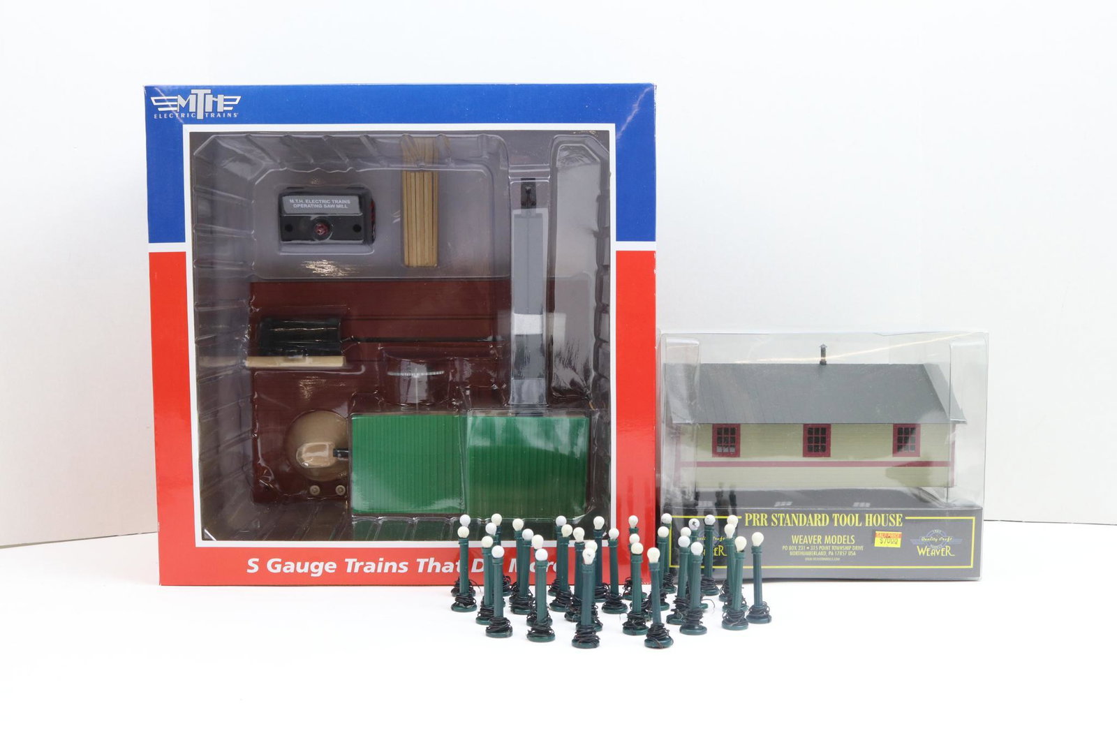 MTH and Weaver Trains Buildings: MTH no. 23796 saw mill, and Weaver Gold Edition PRR standard tool house, both with original boxes.