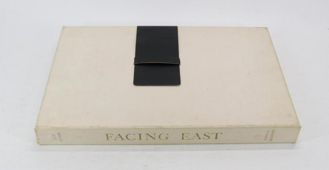 Signed Folio Facing East by James A. Michener and Jack Levine.: A fine 2-part large folio titled "Facing East" with text by James A. Michener (1907-1997) noted American writer and illustrated with original woodcuts by Jack Levine (1915-2010) painter and printmaker