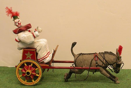 Model Circus Lot.: Model Circus Lot. Clown and cart being pulled by donkey, 12" long. Condition: see Auction Terms and Conditions below.