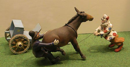 Model Circus Lot.: Model Circus Lot. Mechanical clown and donkey with cart. Condition: see Auction Terms and Conditions below.