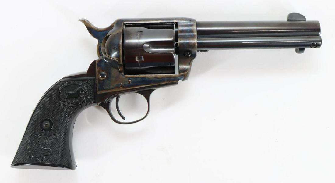 American Western Arms 1873 Peacekeeper Single Action Army SIngle Revolver: 45 Colt 4 3/4" bbl, SN P1558. 98% blue finish on barrel, cylinder and trigger guard/grip strap shows average cylinder drag line, frame shows original case color, very good bore, black checkered plasti