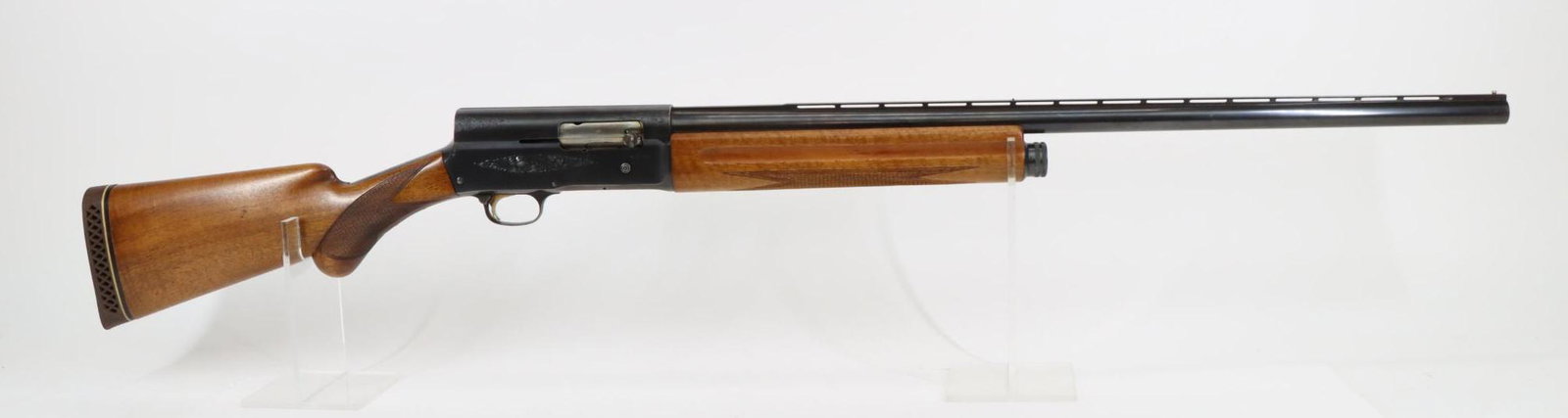 Browning Belgian A5 Light Twelve Semi Automatic Shotgun: 12Ga, 27 1/2" bbl, 2 3/4" chamber, Mod choke, SN 1G45528. 90% blue finish shows general thinning with loss on edges of trigger guard, good bore, vent rib with center bead, engraved receiver, checkered