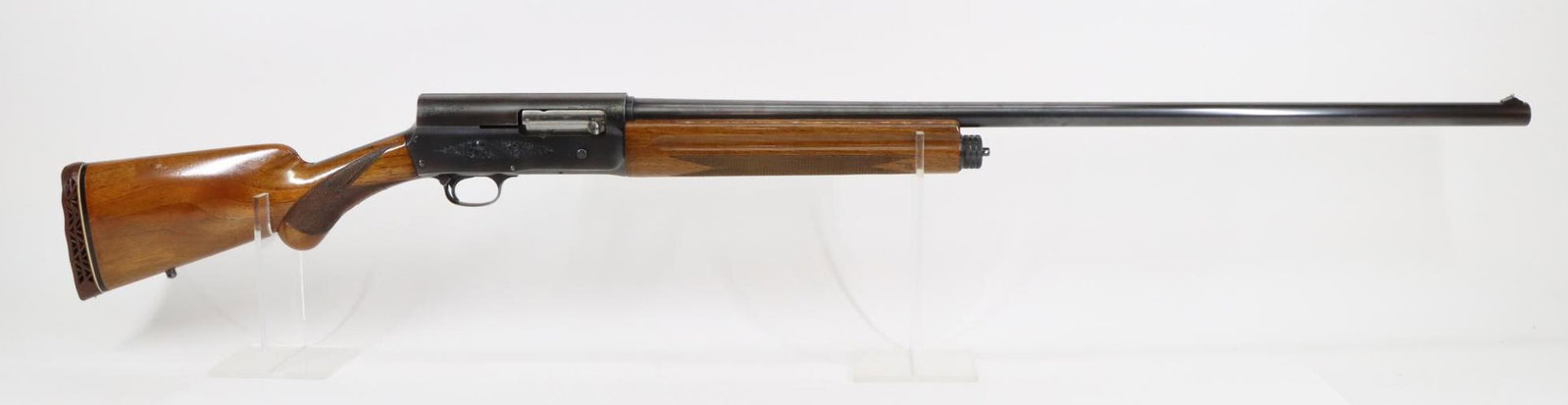 Browning Belgian A5 Magnum Semi Automatic Shotgun: 12Ga, 31 1/2" bbl, 3" chamber, full choke, SN 8V6094. 95% blue finish shows average handling with a few light freckles, thinning on most edges and scratches on top of barrel, good bore, engraved recei