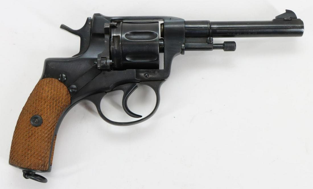 Tula/CAI Nagant M1895 Double Action Revolver: 7.62x38R, 4 1/2" bbl, SN P654. 98% blue finish shows thinning on crisp edges, good bore, left side of frame marked with Tula armory Star with arrow inside (used from1928-1943) and dated 1938, checkere