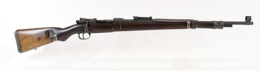 Israeli FN 98 Bolt Action Rifle: 7.62, 23 1/2" bbl, SN 607140. 98% dark gray parkerized type finish shows light handling, good bore, receiver ring marked 7.62 with star shaped crest with sword and vine, older refinished wood stock sh