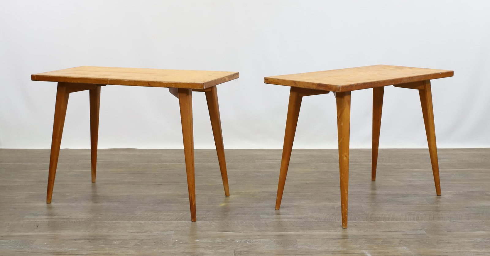 Scandinavian Modern End Tables: Maple with rectangular tops and splayed tapered legs. Made in Sweden. 21"h x 30"w x15"d **Please Note: This item is NOT eligible for in-house shipping. Please refer to the terms and conditions of this